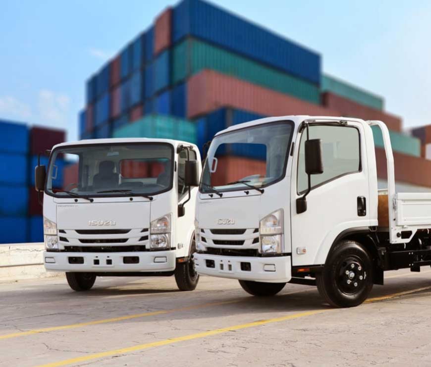 Isuzu N-Series trucks at a container yard