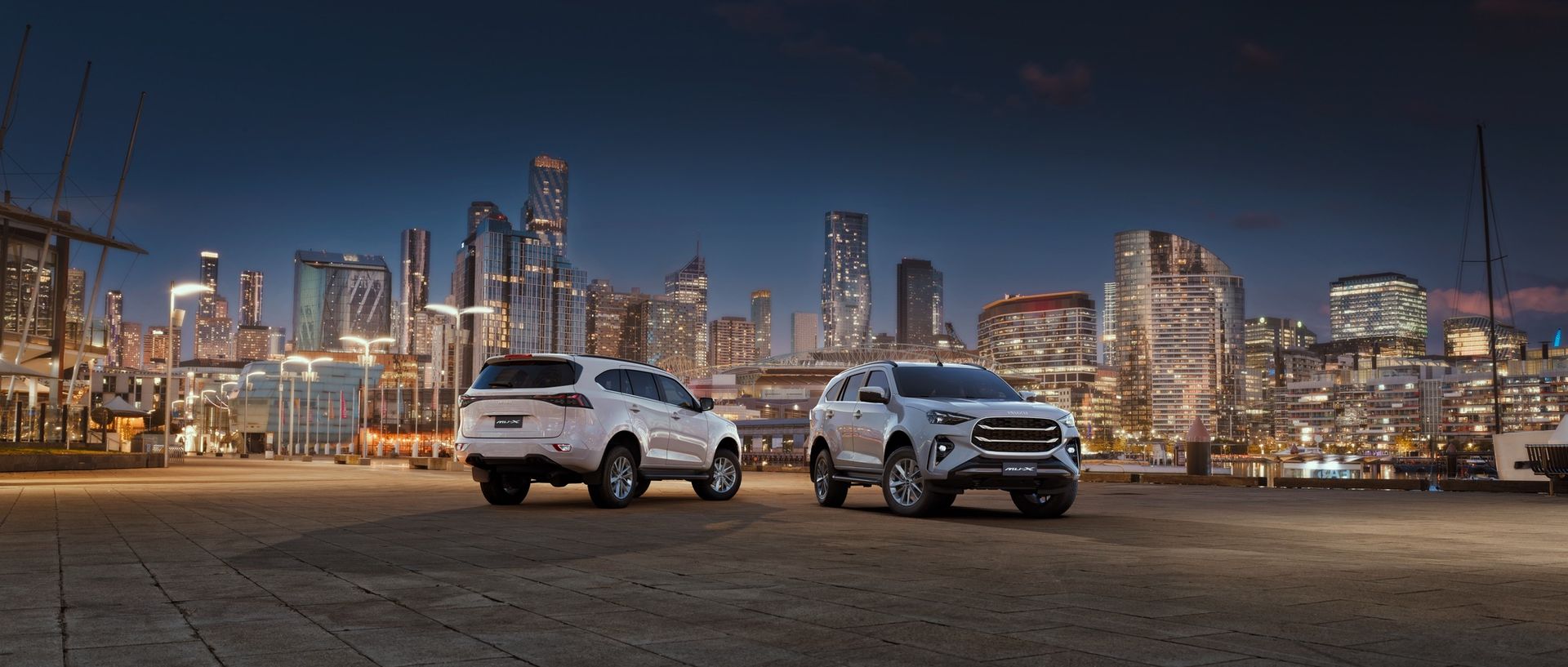 Isuzu MU-X against a city skyline